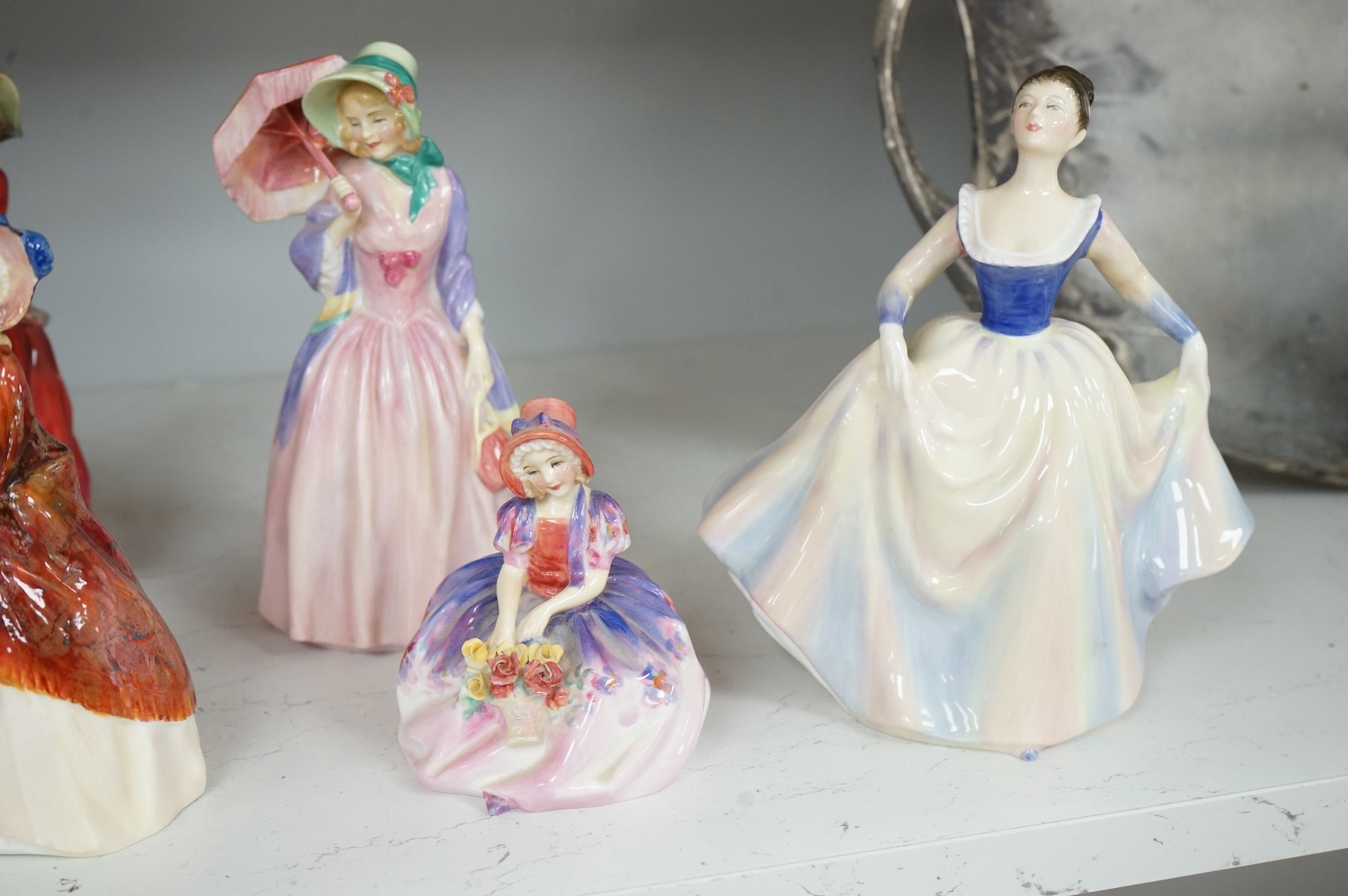 Nine various Royal Doulton figurines